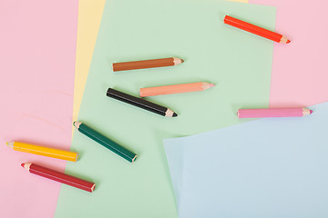 Image showing Color pencils and paper on children desk