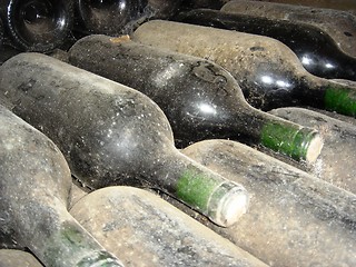 Image showing Old dusty bottles