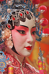 Image showing chinese opera dummy and red cloth as text space ,it is a toy,not