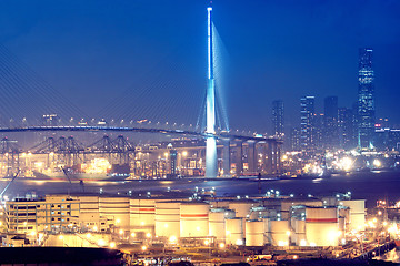 Image showing gas container and bridge at night