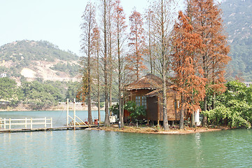 Image showing wood house on water