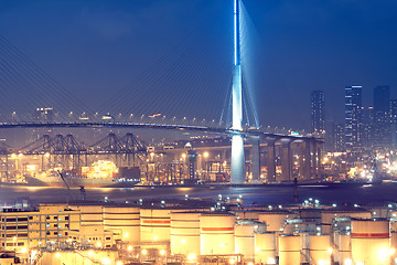 Image showing gas container and bridge at night
