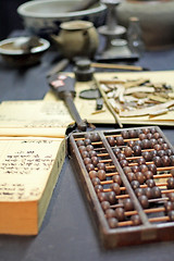 Image showing abacus and book on the table in a chinese old shop 