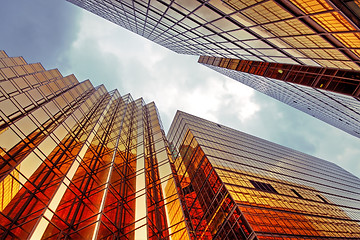 Image showing Skyscrapers with clouds reflection 