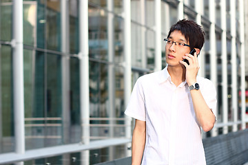 Image showing businessman talks with a mobile phone 