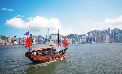 Image showing Junk boat with tourists in Hong Kong Victoria Harbour