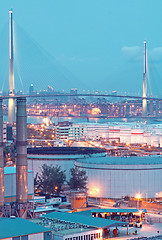 Image showing gas container and bridge at night