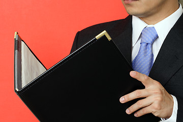 Image showing Reading businessman