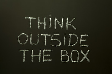 Image showing THINK OUTSIDE THE BOX on a blackboard