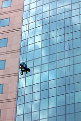 Image showing window cleaner at work