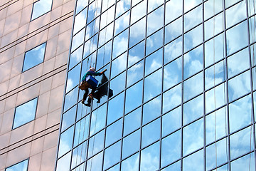 Image showing window cleaner at work