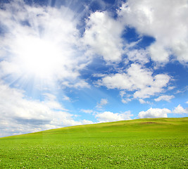 Image showing green hill with grass under sky