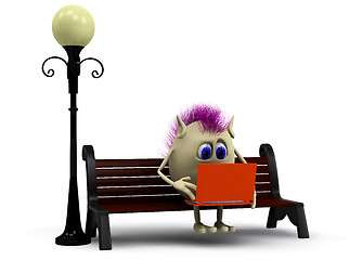 Image showing Haired puppet using orange laptop on bench