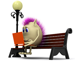 Image showing Haired puppet using laptop on brown bench