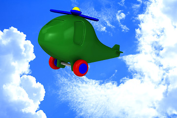 Image showing Green helicopter with tires fly in sky