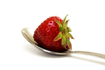 Image showing Zoomed foto of strawberry lying on spoon