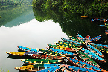 Image showing Colorful tour boats at lakeside