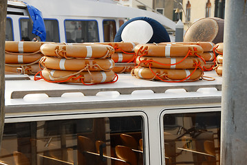 Image showing Stacks of life belts on boat