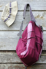 Image showing Khaki Hat and Purple Backpack