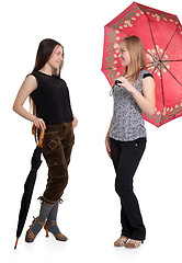 Image showing Two girls with umbrellas