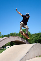 Image showing Skateboarder Doing a Jump at a Concrete Skate Park