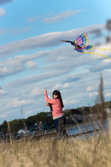 Image showing Woman Flying a Kite at the Beach