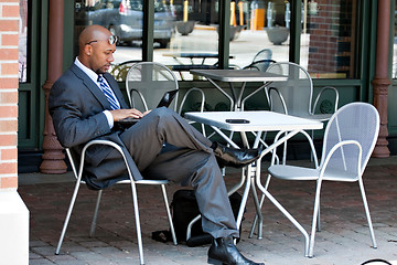 Image showing Business Man Working on His Laptop Outdoors