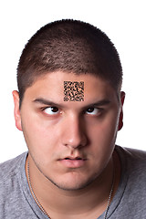 Image showing Young Man with a QR Code On His Forehead