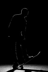 Image showing Rim Lit Skateboarder Silhouette