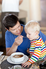 Image showing father and son having a breakfast