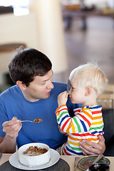 Image showing father and son having a breakfast