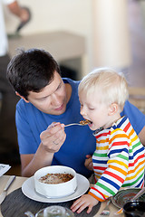 Image showing father and son having a breakfast