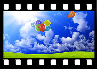 Image showing Filmstrip with color balloons in the dark blue sky