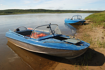 Image showing two motor boats on the shore