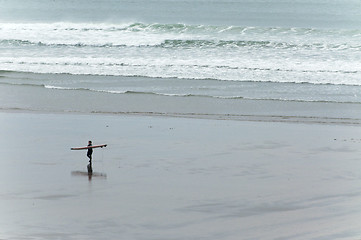 Image showing Surfers walking