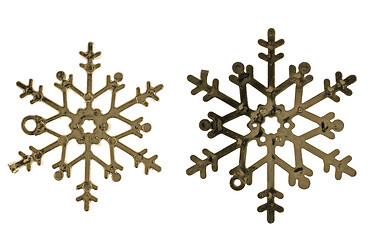 Image showing Two plastic gold color snowflake