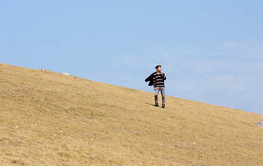Image showing man walking on the mountain