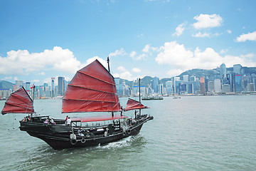 Image showing Junk boat with tourists in Hong Kong Victoria Harbour