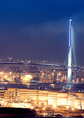 Image showing gas container and bridge at night