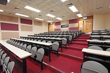 Image showing Empty hall for presentation with grey armchairs 