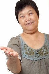 Image showing Young Asian woman hand showing blank sign 