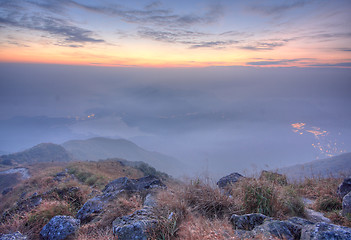 Image showing mountain sunset and colored sky with clouds 