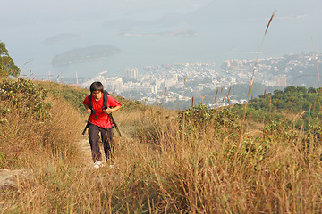 Image showing Sport hiking in mountains, walking and backpacking 