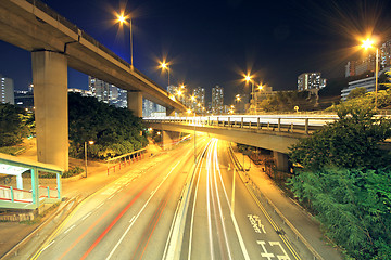 Image showing Traffic through the city (traffic seen as trails of light) 