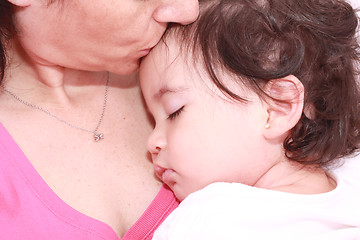 Image showing Woman with sleeping baby 
