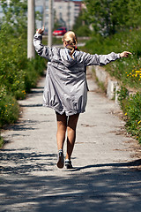 Image showing girl in a silver jacket