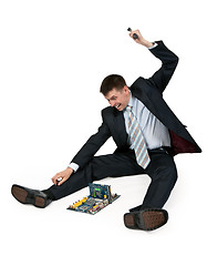 Image showing businessman with a hammer