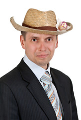 Image showing Handsome businessman with a straw hat