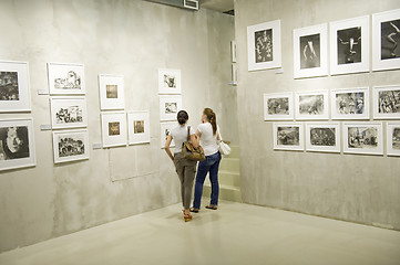 Image showing Two woman on photo exhibition