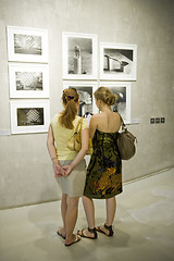 Image showing Two woman on photo exhibition